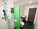 Modern bathroom with green accent tiles