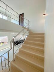 Staircase with modern stainless steel railings