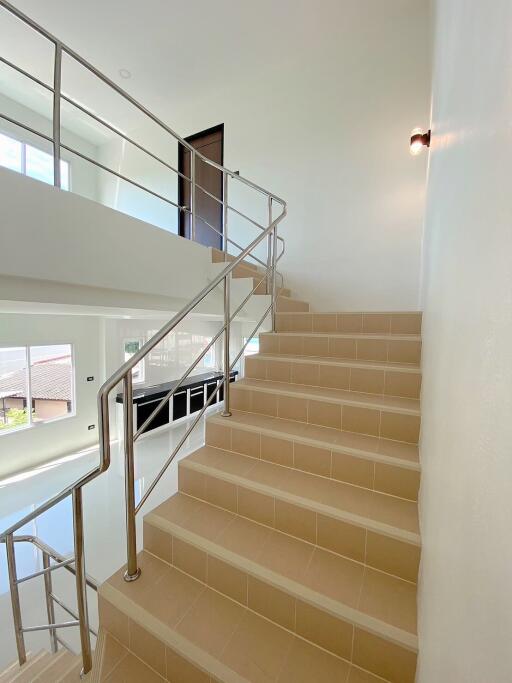 Staircase with modern stainless steel railings