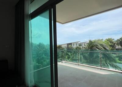 Spacious balcony with glass railings and scenic view
