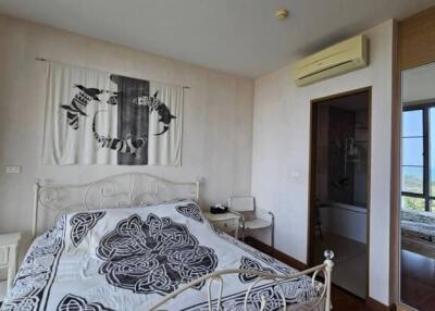 Bedroom with large window and sea view