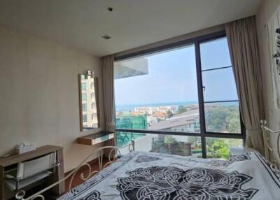 Spacious bedroom with large window and scenic view