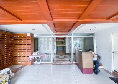 Lobby entrance with reception desk and seating area