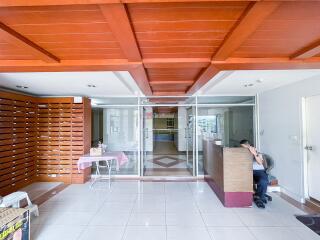 Lobby entrance with reception desk and seating area