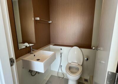 Modern bathroom with a sink, toilet, and shower