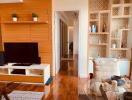 Stylish and modern living room with wooden accents and built-in shelving