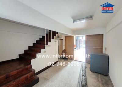Living area with staircase and storage