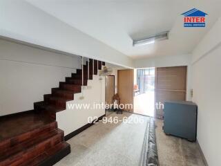 Living area with staircase and storage