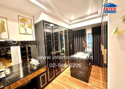 Modern bedroom with built-in wardrobe and vanity