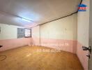 Empty room with wooden floor and a window