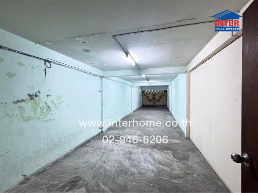 Storage room with concrete floor and ceiling lights