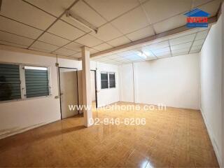 A spacious room in the property with tiled flooring and ceiling lights