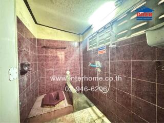 Shower area with intricate tile design