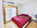 Cozy bedroom with a large bed and natural light