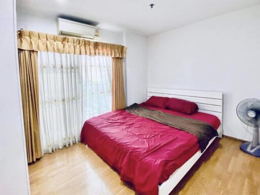 Cozy bedroom with a large bed and natural light