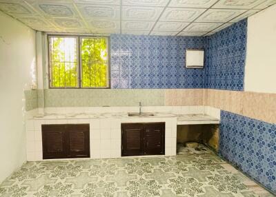 Tiled kitchen with window