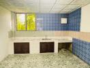 Tiled kitchen with window