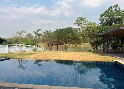 Backyard with pool and greenery