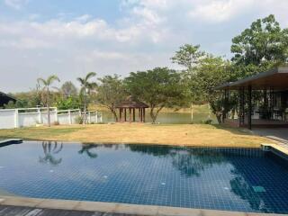 Backyard with pool and greenery