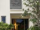 Front entrance of a modern house with greenery