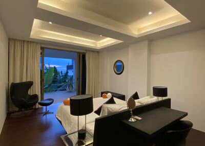 Modern bedroom with contemporary furniture and recessed lighting