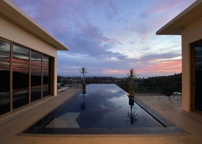 A stunning infinity pool with a view of the sunset