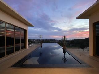 A stunning infinity pool with a view of the sunset