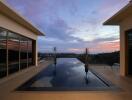 A stunning infinity pool with a view of the sunset