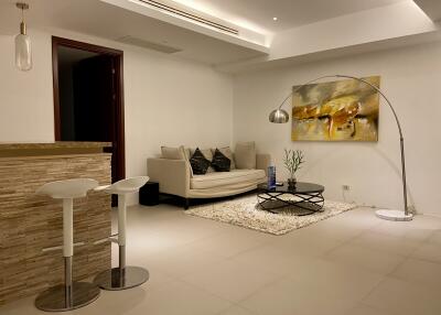 Modern living room with white furniture and artwork
