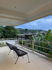 Balcony with chairs and scenic view