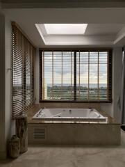 Modern bathroom with jacuzzi and large window