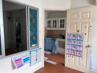 Kitchen with door and charts