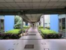 Covered walkway with surrounding greenery in a residential building