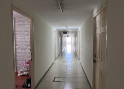 hallway with doors and lighting