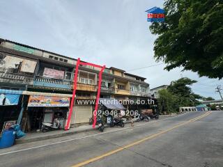 Street view of a commercial and residential building