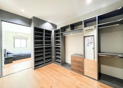 Spacious bedroom with a large walk-in closet