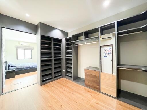 Spacious bedroom with a large walk-in closet