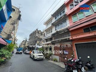 Street view of residential buildings and shops