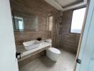 Modern bathroom with large mirror and walk-in shower