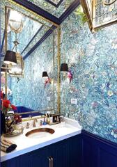 Stylish bathroom with vibrant floral wallpaper and modern fixtures