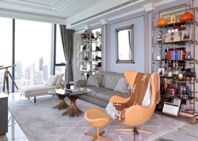 Modern living room with city view, luxurious furniture, and decor.