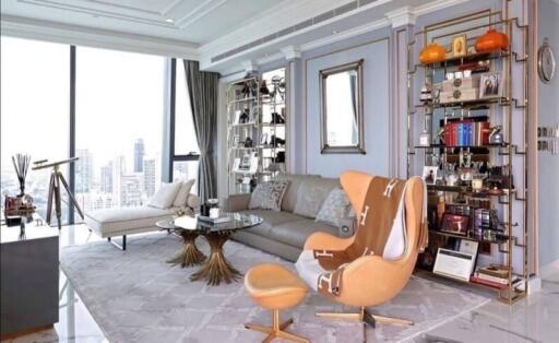 Modern living room with city view, luxurious furniture, and decor.