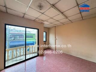 Empty room with tiled floor and large window