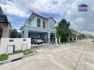 Two-story house with garage and driveway