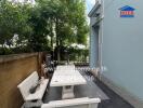 Outdoor seating area with table and benches