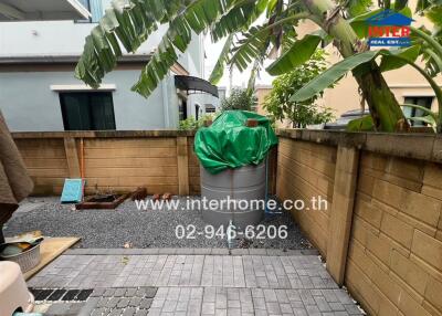 Backyard area with garden and storage