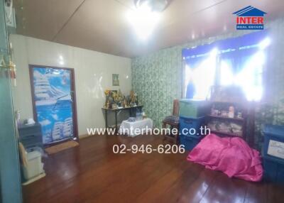 Room with wooden floor and decorative items