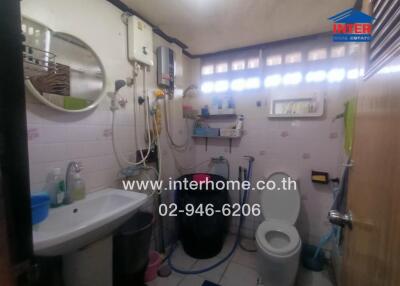 Bathroom with sink, toilet, and shower