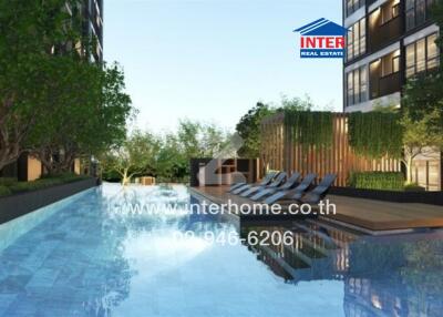 Outdoor swimming pool with lounge chairs and greenery
