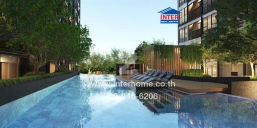 Outdoor swimming pool with lounge chairs and greenery